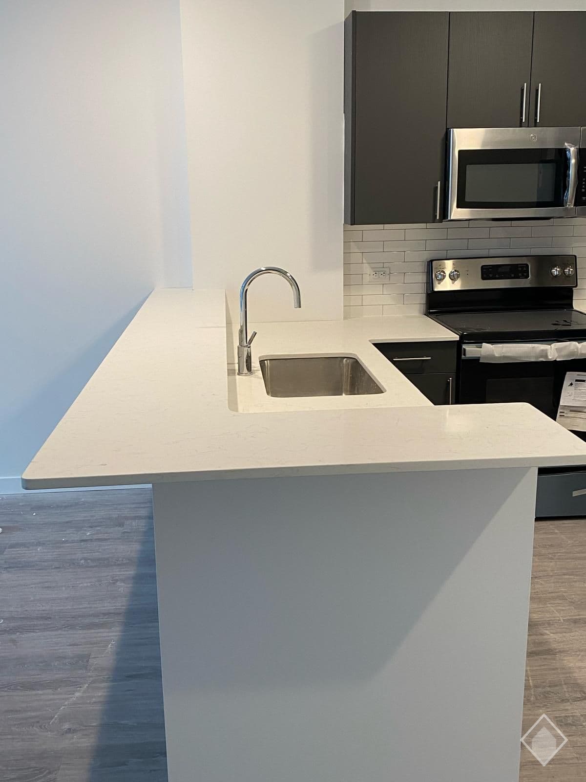 Bianco Carrara Quartz in The Brick of Hackensack | Hackensack, New Jersey — Kitchens