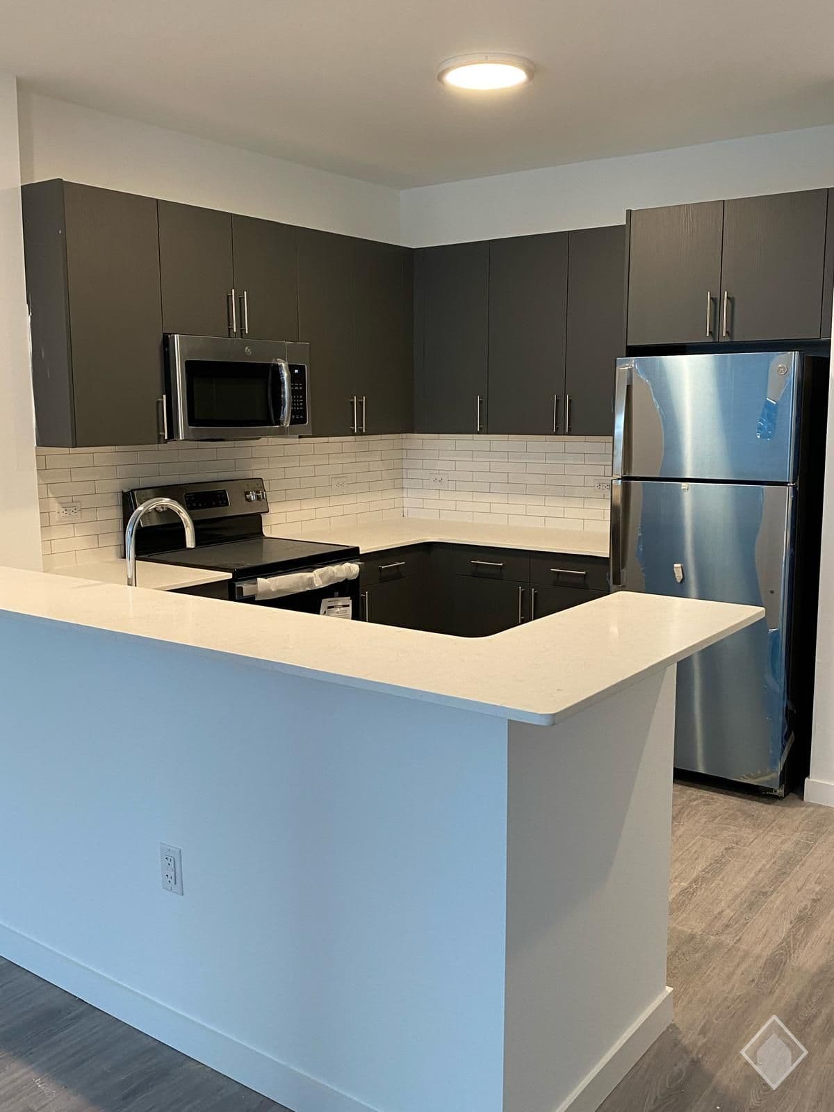 Bianco Carrara Quartz in The Brick of Hackensack | Hackensack, New Jersey — Kitchens